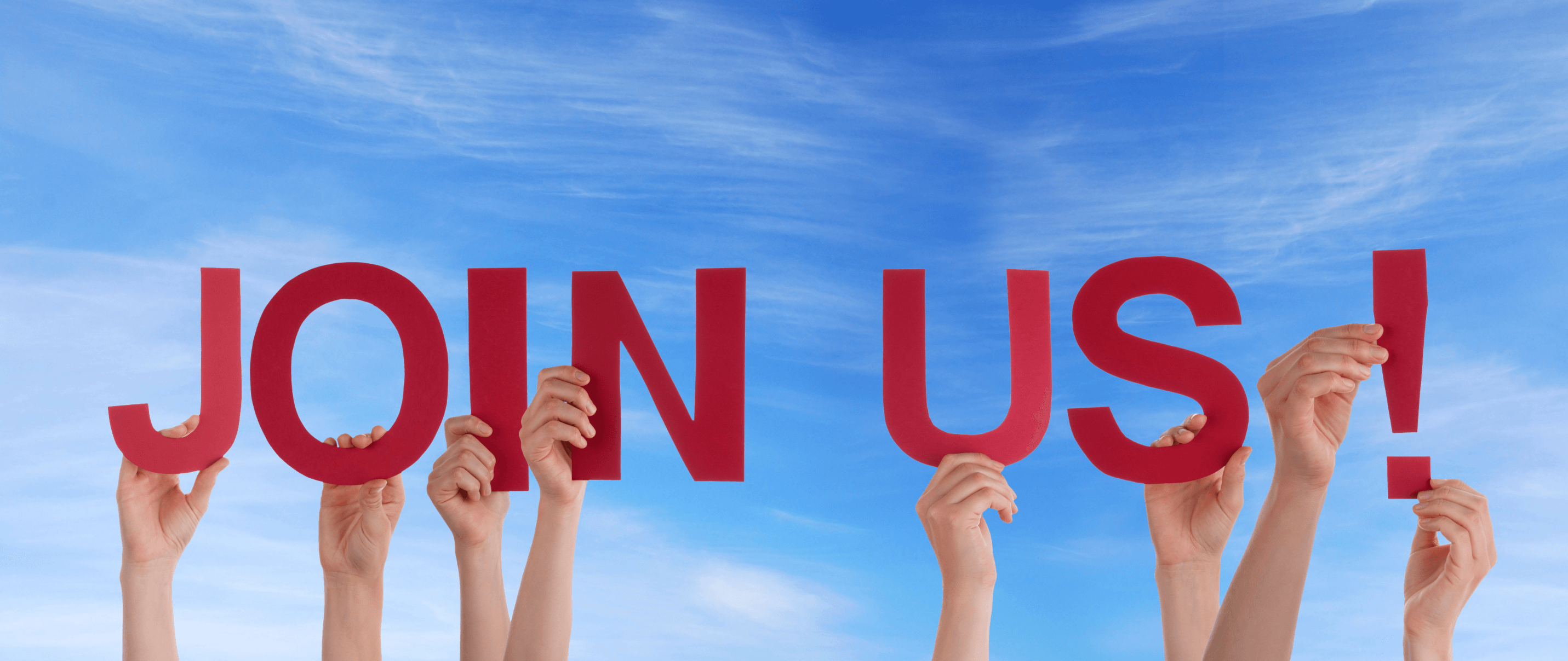 people holding up Join Us sign