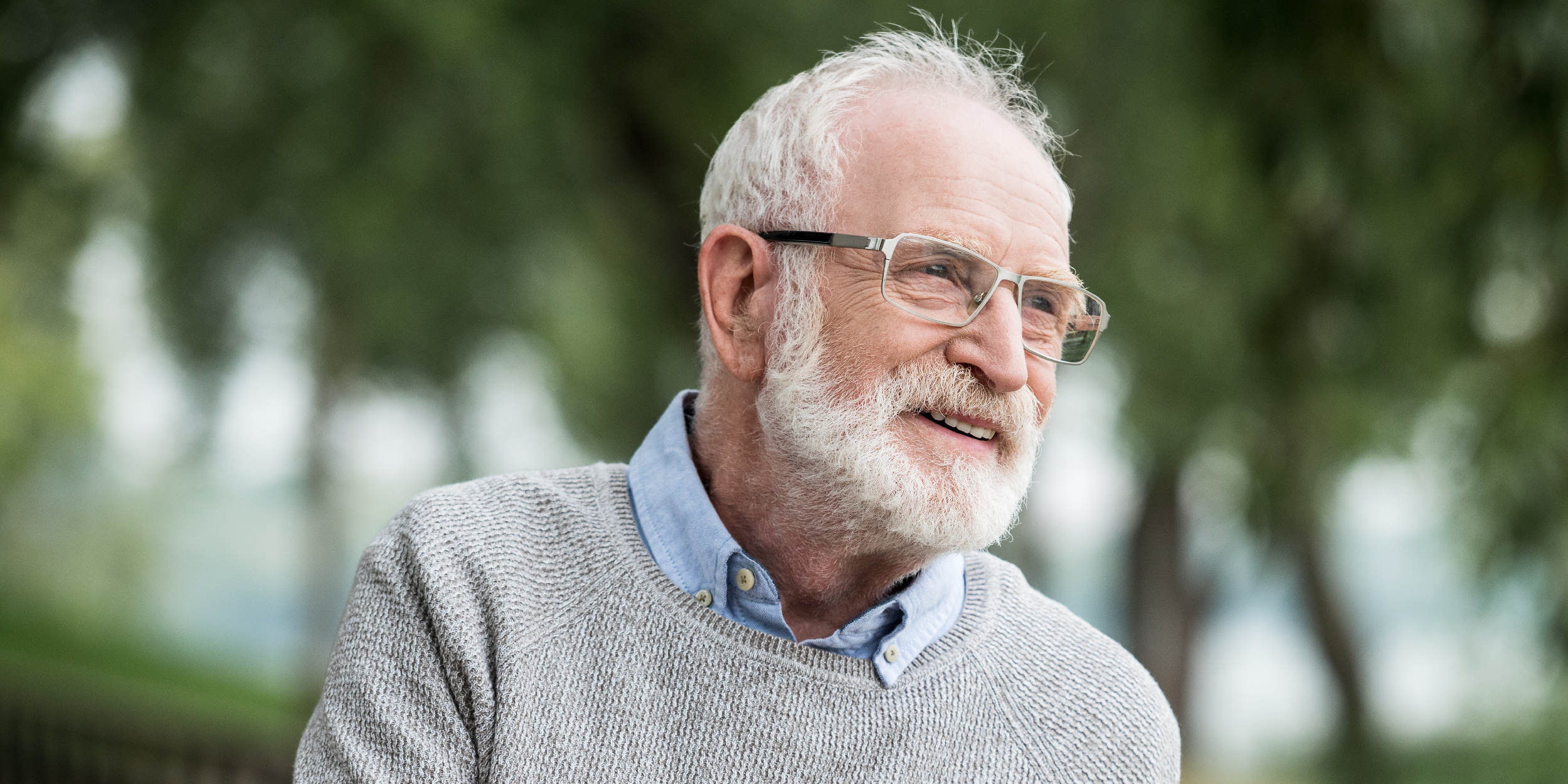 Senior man with gray hair and glasses
