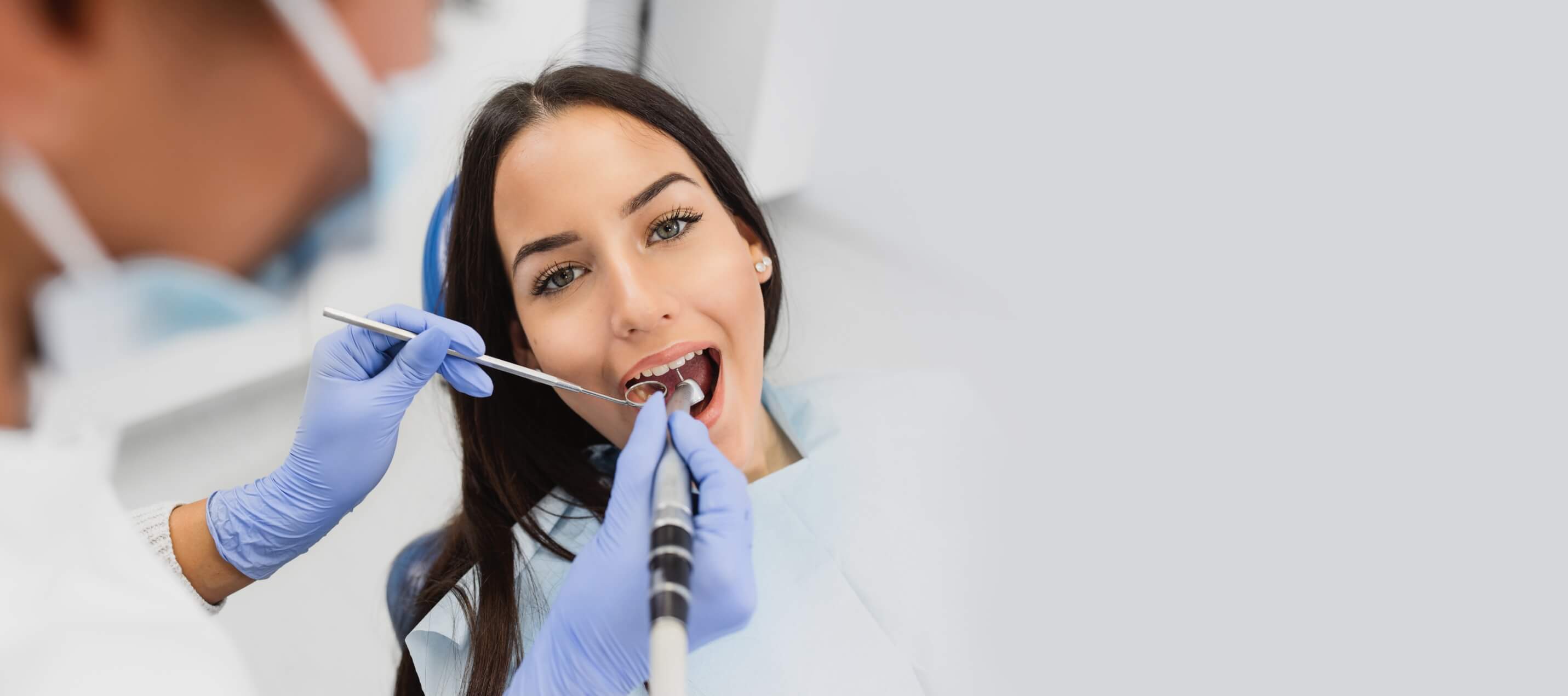 woman in dentist chair getting dental work done