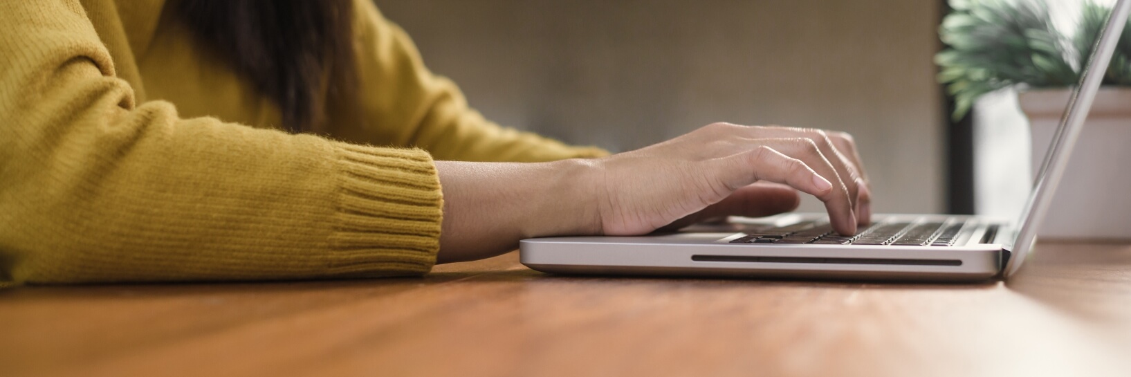 woman pulling up forms on laptop